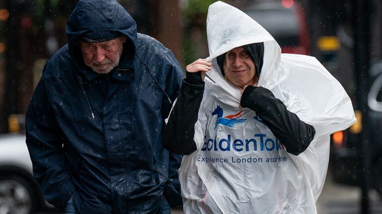 People walk through the rain and wet weather in Victoria, London. Picture date: Wednesday September 20, 2023.