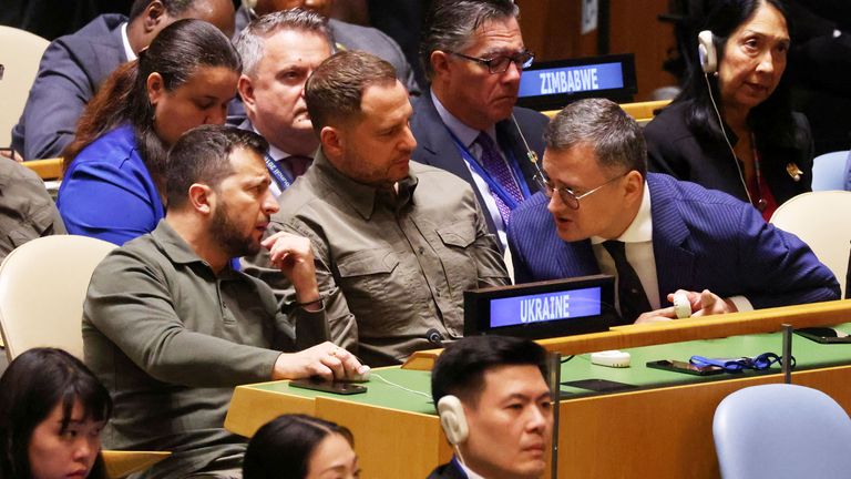 Ukraine&#39;s President Volodymyr Zelenskyy speaks with his delegation in the Geneal Assembly hall as he attends the 78th Session of the U.N. General Assembly in New York City, U.S., September 19, 2023.  REUTERS/Caitlin Ochs