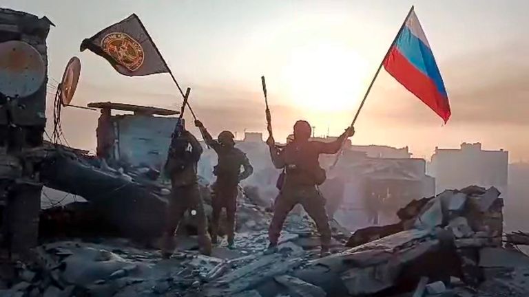 FILE - In this image from video provided by Prigozhin Press Service on Saturday, May 20, 2023, Yevgeny Prigozhin&#39;s Wagner Group military company members wave a Russian national and Wagner flag atop a damaged building in Bakhmut, Ukraine. Yevgeny Prigozhin&#39;s armed revolt against Russia&#39;s military leadership posed the greatest challenge to Vladimir Putin&#39;s authorities in his 23-year rule. (Prigozhin Press Service via AP, File)