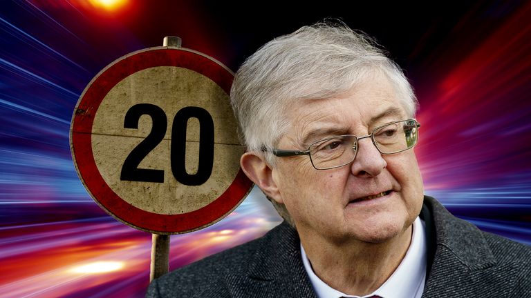Mark Drakeford with a 20mph sign
