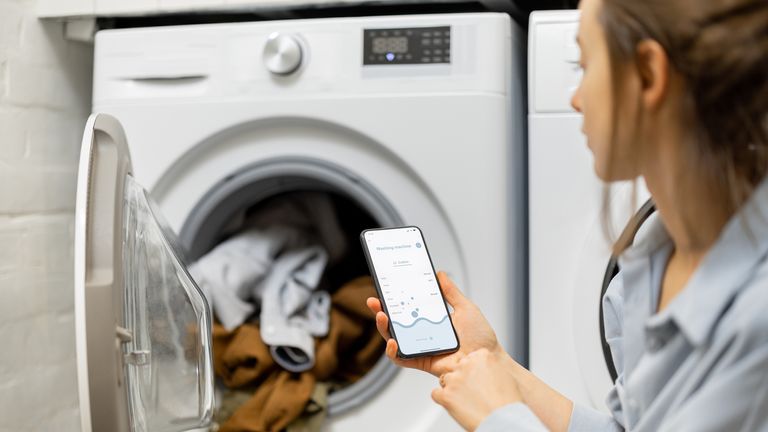Smart washing machines allow users to operate them remotely via an app. File pic