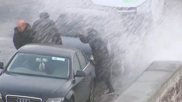 Storm Agnes made landfall with 80mph gusts, downing power lines and causing flooding. It also showed no mercy to those walking along the coast as they were drenched by sea waves riding up onto the roads.