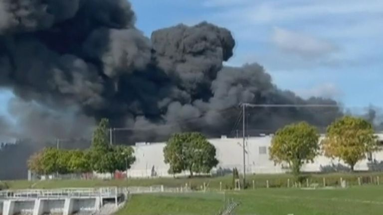 Huge plume of black smoke billows up from a fire at a Wisconsin warehouse