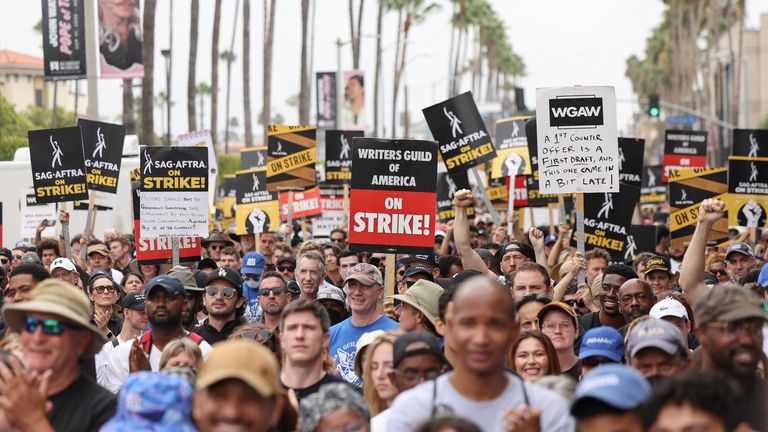 SAG-AFTRA actors and Writers Guild of America (WGA) writers rally during their ongoing strike, in Los Angeles