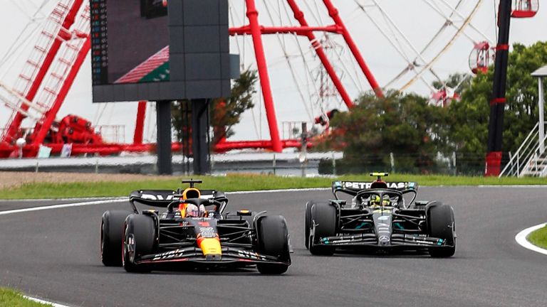 SUZUKA, JAPAN - SEPTEMBER 22: Max Verstappen, Red Bull Racing RB19, leads Sir Lewis Hamilton, Mercedes F1 W14 during the Japanese GP at Suzuka on Friday September 22, 2023 in Suzuka, Japan. (Photo by Jake Grant / LAT Images)