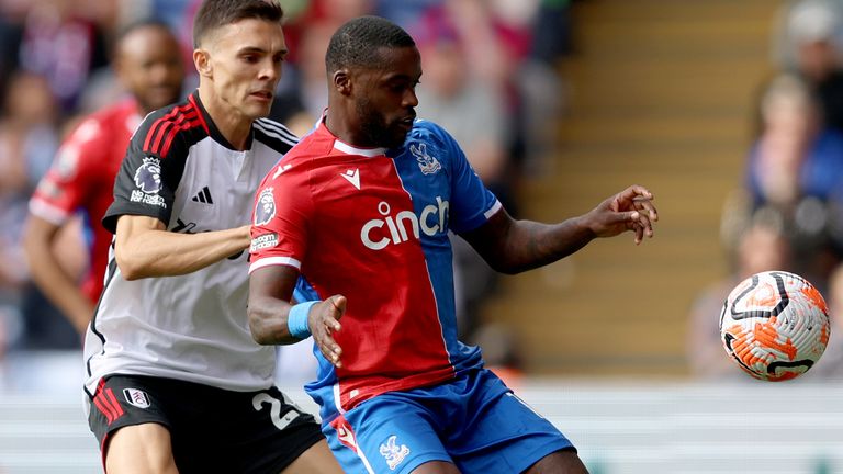 Jeffrey Schlupp of Crystal Palace is challenged by Joao Palhinha of Fulham in action