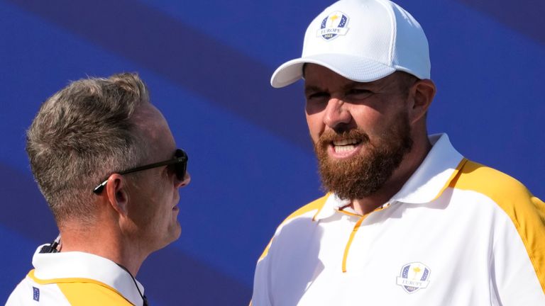 Europe&#39;s Team Captain Luke Donald , left shakes hands with Europe&#39;s Shane Lowry on the 1st tee during a practice round ahead of the Ryder Cup at the Marco Simone Golf Club in Guidonia Montecelio, Italy, Tuesday, Sept. 26, 2023. The Ryder Cup starts Sept. 29, at the Marco Simone Golf Club. (AP Photo/Andrew Medichini)
