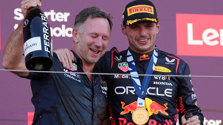 Red Bull driver Max Verstappen of the Netherlands, right, celebrates on the podium with Red Bull team principal Christian Horner after winning the Japanese Formula One Grand Prix at the Suzuka Circuit, Suzuka, central Japan, Sunday, Sept. 24, 2023. (AP Photo/Toru Hanai)