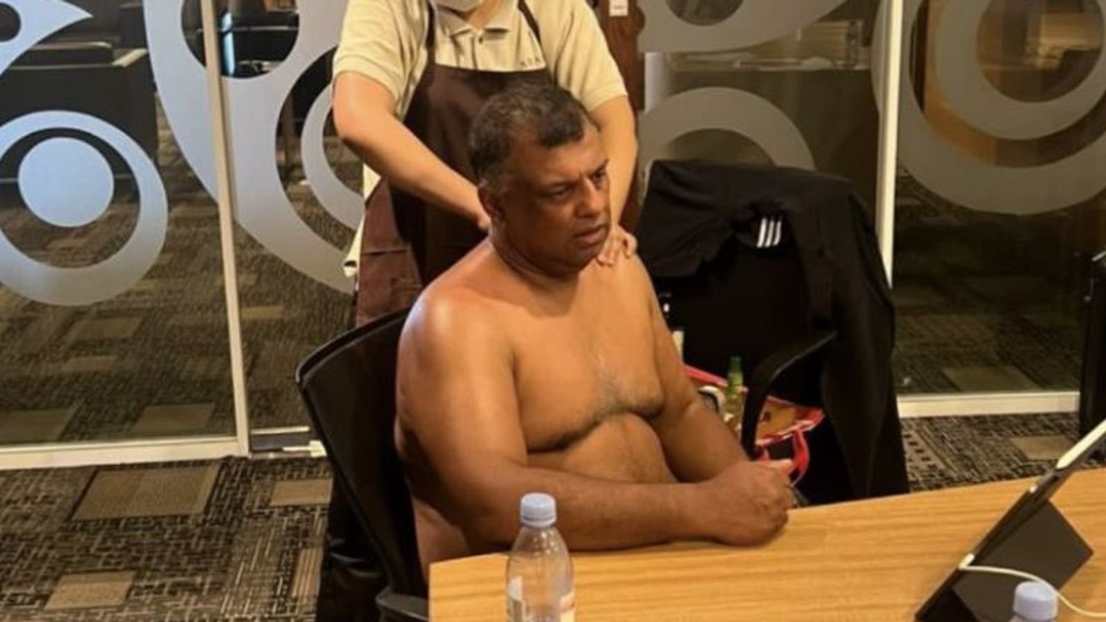 AirAsia boss Tony Fernandes criticised for posting topless photo of himself getting massage during meeting