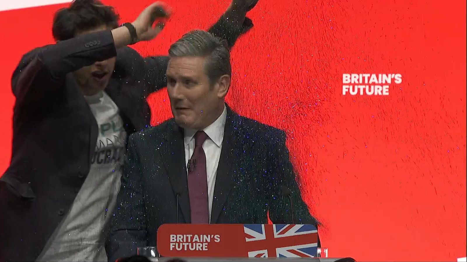 Labour: Keir Starmer covered in glitter by protester in chaotic opening