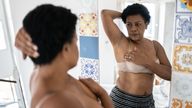 Woman doing self breast exam at home. Pic: iStock