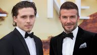 Brooklyn Beckham, left and his father David Beckham, pose for photographers upon arrival for the premiere of a new series of Our Planet, at the Natural History Museum in central London, Tuesday, April 4, 2019. (Photo by Joel C Ryan/Invision/AP)
