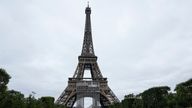 People relax at Champ-de-Mars in front of the Eiffel Tower. Pic: AP