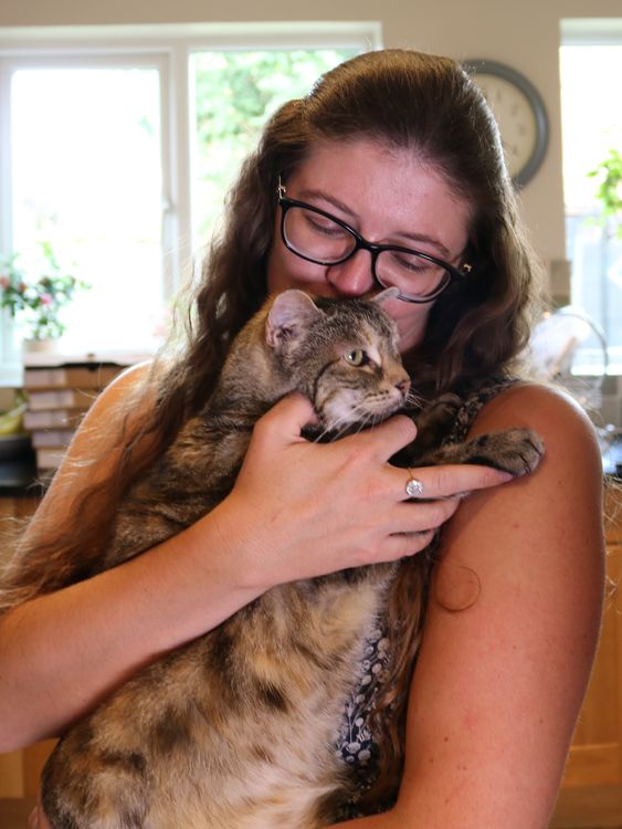 Nicole Spink with her cat Bella, who holds the Guinness World Record for the loudest purr