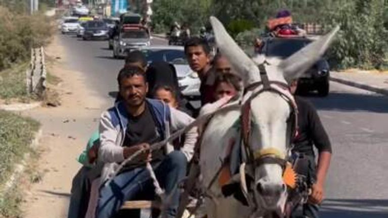 People were seen fleeing northern Gaza on donkey-drawn carts as rockets flew overhead on Friday, October 13, after the Israel Defence Forces warned residents to head south.