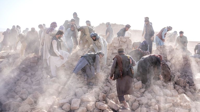 Afghan volunteers search through rubble after an earthquake in Zenda Jan district in Herat province, western Afghanistan
Pic:AP