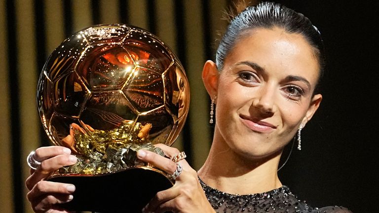 FC Barcelona's and Spain's national team's midfielder Aitana Bonmati holds the trophy as she receives the 2023 Women's Ballon d'Or award