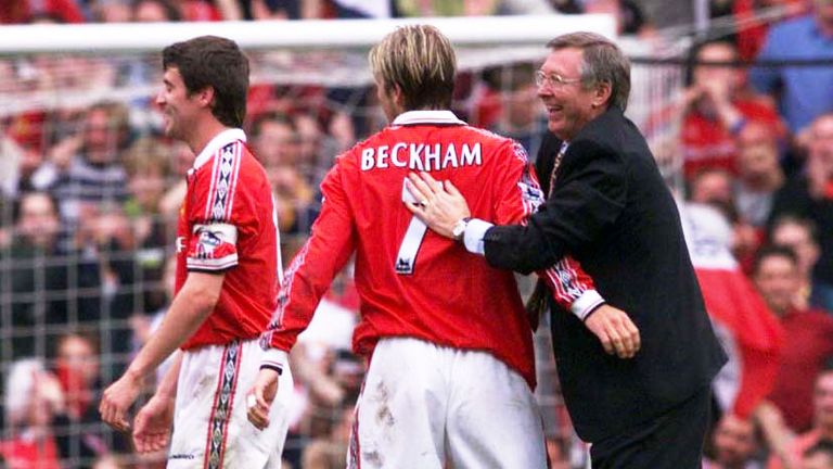 Alex Ferguson (right) congratulates David Beckham (centre) and Roy Keane after his side clinched the Premiership Title at Old Trafford