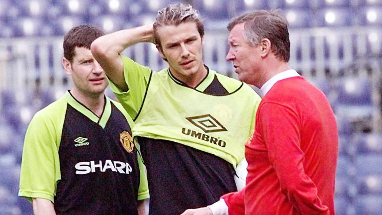 Manchester United manager Alex Ferguson talks tactics with David Beckham and  at their teams training session at the Nou Camp stadium in Barcelona.