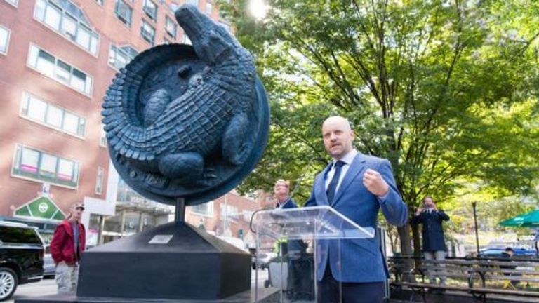The sculpture of an alligator on a manhole cover, called NYC Legend, was unveiled in Union Square Park by Swedish artist Alexander Klingspor. Pic: Union Square Partnership