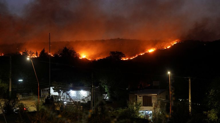A view shows a wildfire, that has forced the evacuation of residents, near a neighbourhood, as one suspect was arrested for allegedly causing the blaze, according to Cordoba&#39;s governor Juan Schiaretti, in Villa Carlos Paz, Argentina