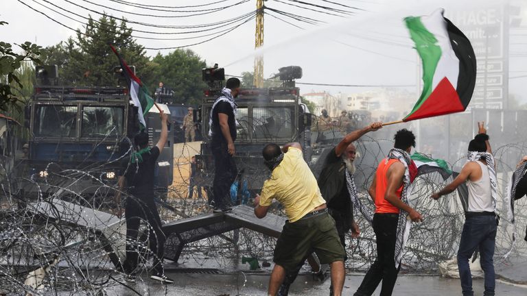 People clash with security forces during a protest near the U.S. embassy in Awkar, Lebanon, after Palestinians were killed in a blast at Al Ahli hospital in Gaza that Israeli and Palestinian officials blamed on each other