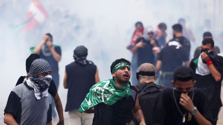 People clash with security forces during a protest near the U.S. embassy in Awkar, Lebanon, after Palestinians were killed in a blast at Al Ahli hospital in Gaza that Israeli and Palestinian officials blamed on each other