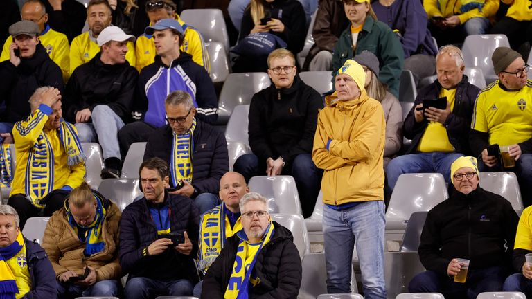 Sweden supporters react on stands during the Euro 2024 group F qualifying soccer match between Belgium and Sweden at the King Baudouin Stadium in Brussels, Monday, Oct. 16, 2023. Two Swedes were killed in a shooting late Monday in central Brussels, police said, prompting Belgium&#39;s prime minister and senior Cabinet minister to hunker down at their crisis center for an emergency meeting. (AP Photo/Geert Vanden Wijngaert)