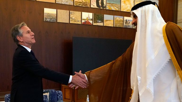 U.S. Secretary of State Antony Blinken, left, and Qatari Emir Sheikh Tamim bin Hamad Al Thani shake hands before their meeting in Lusail, Qatar, Friday Oct. 13, 2023. (AP Photo/Jacquelyn Martin, Pool)