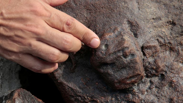 A view of an ancient stone carving on a rocky point of the Amazon river that was exposed after water levels dropped to record lows during a drought in Manaus, Amazonas state, Brazil 