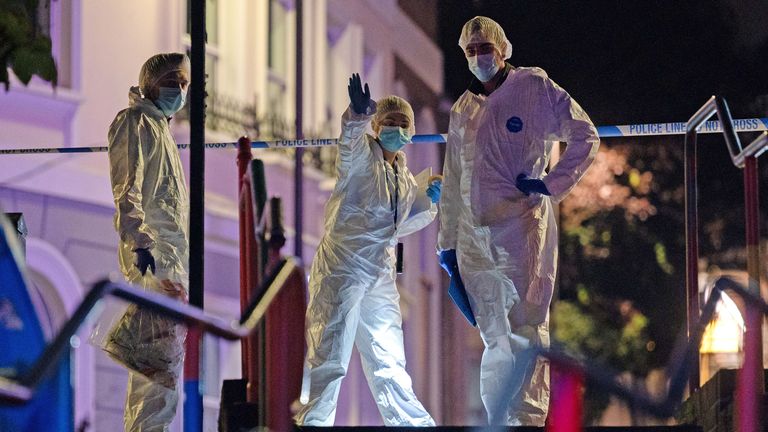 Forensic investigators at the scene in Brighton