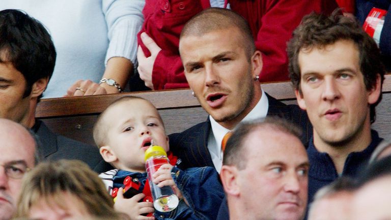 David Beckham and Brooklyn watch Manchester United take on Ipswich Town in 2001. Pic: Reuters