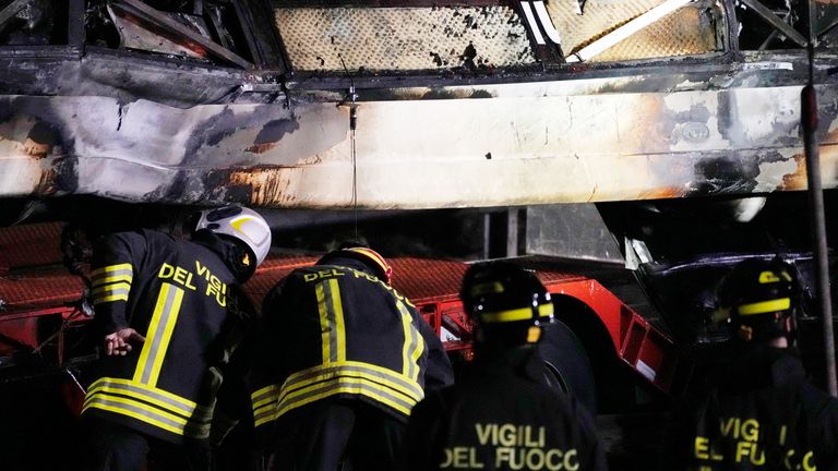 Italian firefighters work at the scene of a passenger bus accident in Mestre, near the city of Venice, Italy 
Pic:AP
