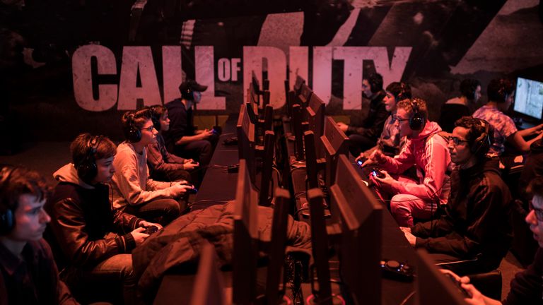 Visitors play Call of Duty WWII video game at the Paris Games Week in Paris, Friday, Nov. 3, 2017. The Paris Games Week, or more commonly called 