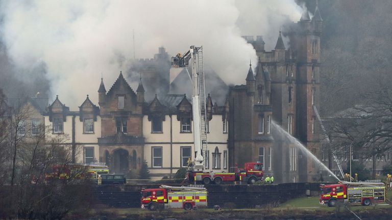 Firefighters at the scene following a fire at the Cameron House Hotel on the banks of Loch Lomond in Scotland.