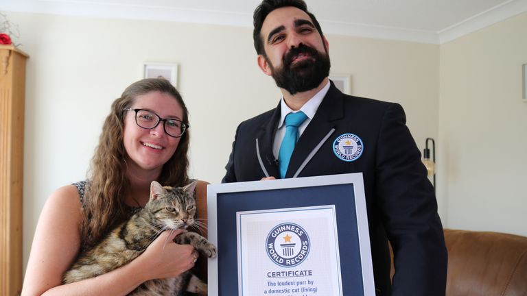 Bella being presented the Guinness World Record for the loudest purr