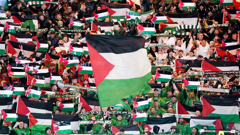 Celtic fans in the stands wave flags of Palestine during the UEFA Champions League Group E match at Celtic Park, Glasgow. Picture date: Wednesday October 25, 2023. PA Photo. See PA story SOCCER Celtic. Photo credit should read: Andrew Milligan/PA Wire...RESTRICTIONS: Use subject to restrictions. Editorial use only, no commercial use without prior consent from rights holder..