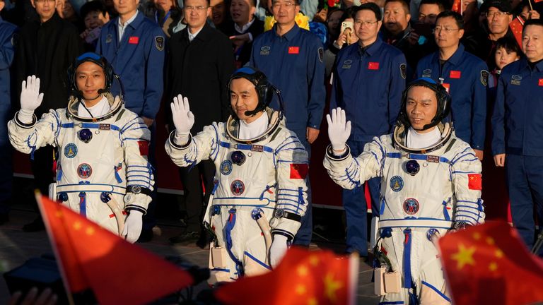 Jiang Xinlin, Tang Hongbo and Tang Shengjie wave before take off. PIC: AP