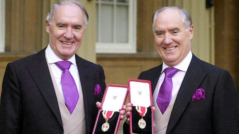 Sir David Barclay (left) and his twin brother Sir Frederick after receiving their knighthoods from the Queen at Buckingham Palace