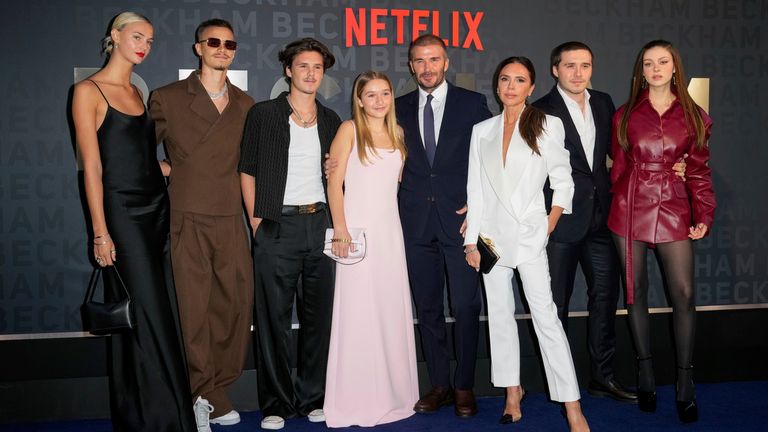 Mia Regan, from left, Romeo Beckham, Cruz Beckham, Harper Beckham, David Beckham, Victoria Beckham, Brooklyn Beckham and Nicola Peltz Beckham pose for photographers upon arrival at the premiere of the television programme &#39;Beckham&#39; on Tuesday, Oct. 3, 2023 in London. (Scott Garfitt/Invision/AP)