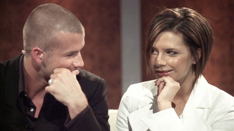 David Beckham (L), British soccer star and his wife Victoria, guests of.television host Thomas Gottschalk, smile at each other during German.television show "Bet It...?!" (Wetten Dass...?!) in Erfurt October 13,.2001. "Wetten Dass...?!" is Europe&#39;s most successful television show..REUTERS/Ralph Orlowski..ROR/WS