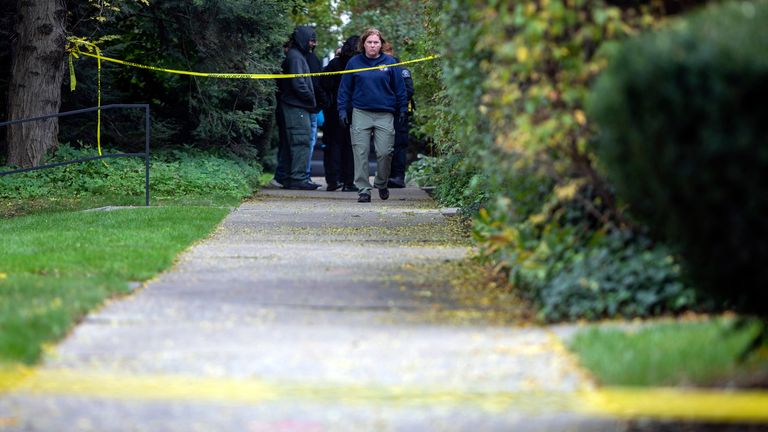 A law enforcement agent walks near the scene near the scene where a Detroit synagogue president, Samantha Woll, was found dead in Detroit. Pic: AP