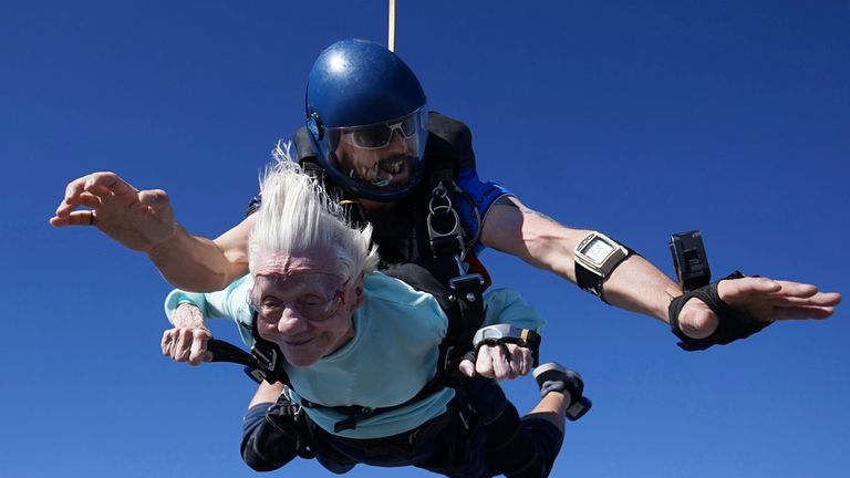 This photo provided by Daniel Wilsey shows Dorothy Hoffner, 104, falling through the air with tandem jumper Derek Baxter as she becomes the oldest person in the world to skydive, Sunday, Oct. 1, 2023, at Skydive Chicago in Ottawa, Ill. (Daniel Wilsey via AP)