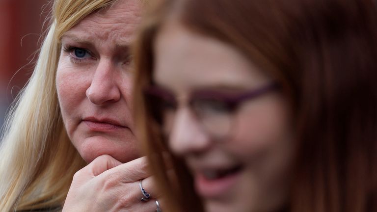 A mother of a student reacts after a teacher was killed and several people injured in a knife attack at the Lycee Gambetta-Carnot high school in Arras, northern France, October 13, 2023. REUTERS/Pascal Rossignol
