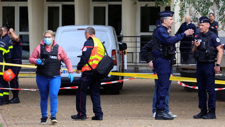 French police and fire fighters work after a teacher was killed and several people injured in a knife attack at the Lycee Gambetta-Carnot high school in Arras, northern France, October 13, 2023. REUTERS/Pascal Rossignol
