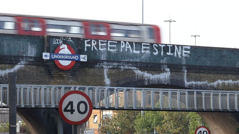 A Tube train bridge, branded with &#39;Free Palestine&#39; graffiti, is seen in in Golders Green, London, Britain, October 9, 2023. REUTERS/Anna Gordon