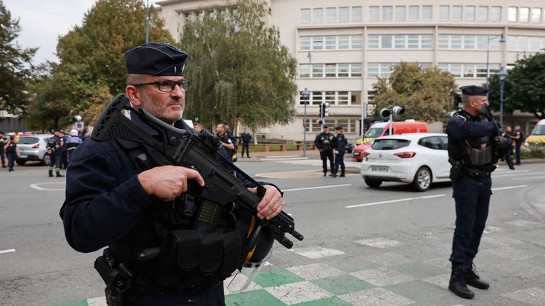 French police secure the area after a teacher was killed and several people injured in a knife attack at the Lycee Gambetta-Carnot high school in Arras, northern France, October 13, 2023. REUTERS/Pascal Rossignol