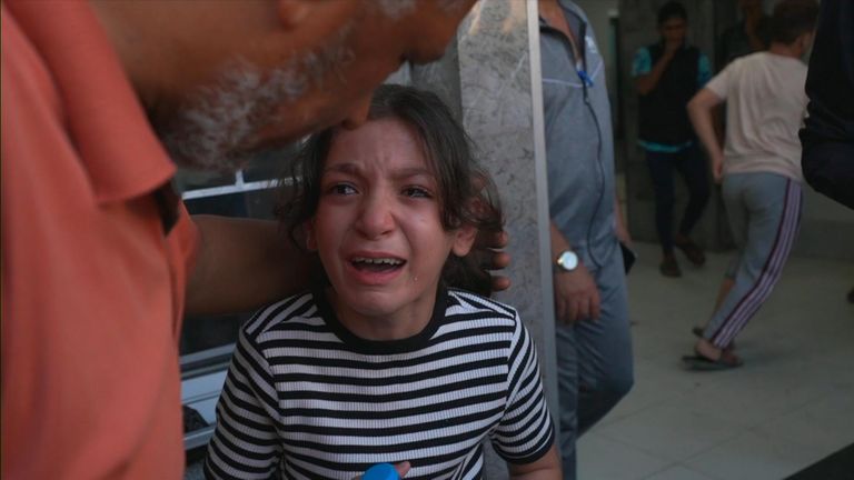 Girl crying outside hospital in Gaza