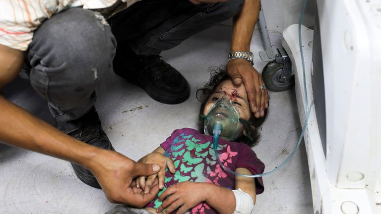 A young Palestinian wounded waits for treatment on the floor of Shifa Hospital in Gaza. Pic: AP