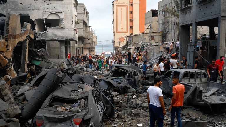 Palestinians inspect damages in the aftermath of Israeli strikes, following a Hamas surprise attack, at Beach refugee camp, in Gaza City, October 9, 2023. REUTERS/Mohammed Salem